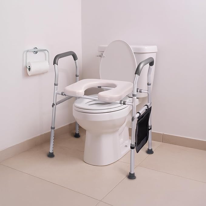Carex Padded Raised Toilet Seat with Handles, Adjustable Height, Padded Waterproof Seat, Non-Slip Legs, Heavy-Duty Frame, Supports up to 300 lbs, Fits Most Toilets